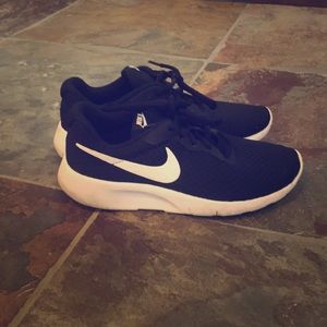 Kids Nike tennis shoes.